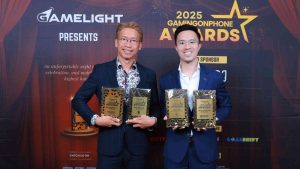 Moonton Games holding its four awards at the GamingonPhone Awards 2025