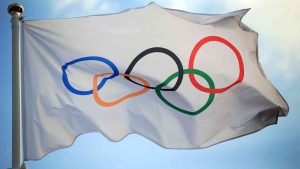 International Olympic flag flying in the wind
