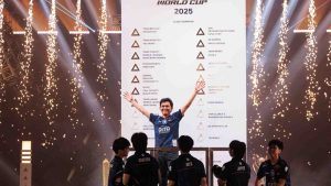 Team Liquid Philippines KarlTzy raises his arms in victory after TLPH's win in the Grand Finals